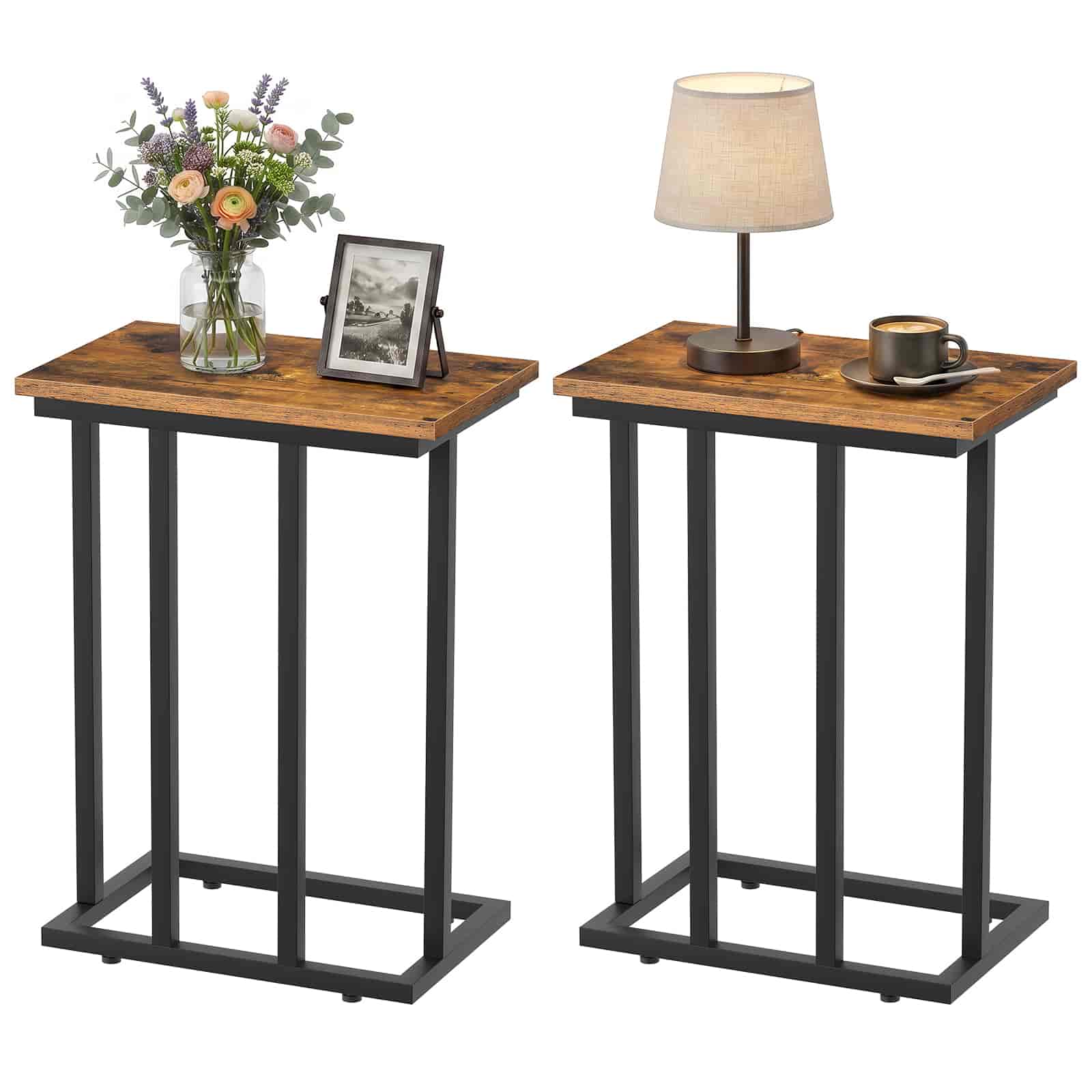 Two wooden side tables with black metal legs, one with a lamp and cup, the other with flowers and photo frame.