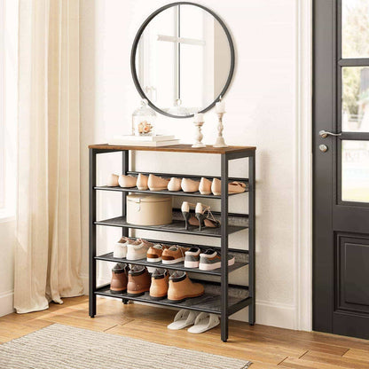 Shoe rack with shoes in a room with a mirror and door.
