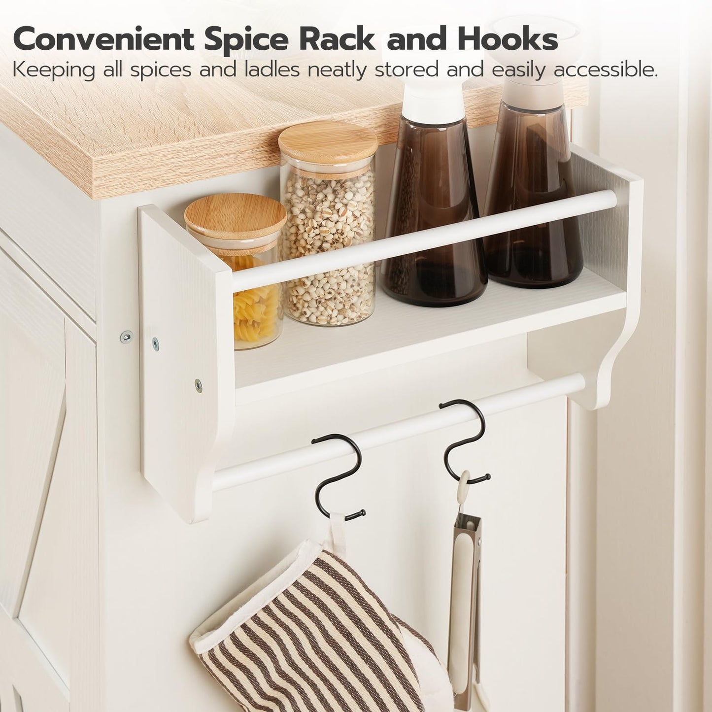 Close up of the integrated side spice organizer rack with black hanging hooks holding a towel and bottles.