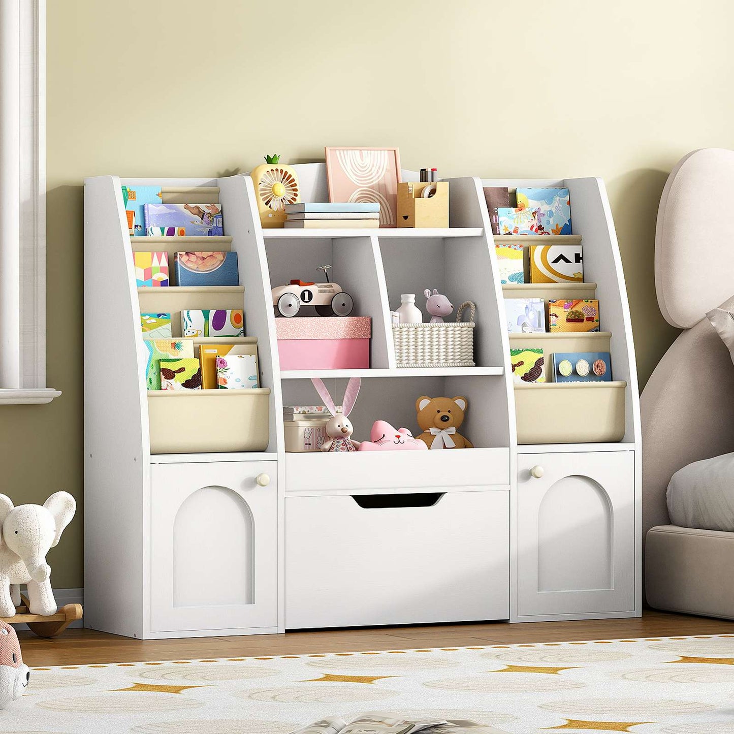  White castle-themed kids bookshelf and toy organizer placed on a rug in a modern playroom.