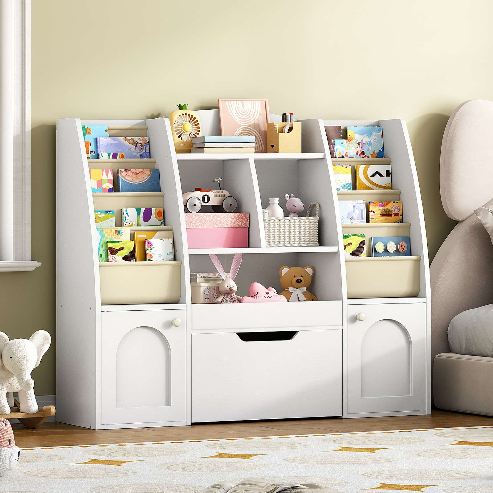  White castle-themed kids bookshelf and toy organizer placed on a rug in a modern playroom.