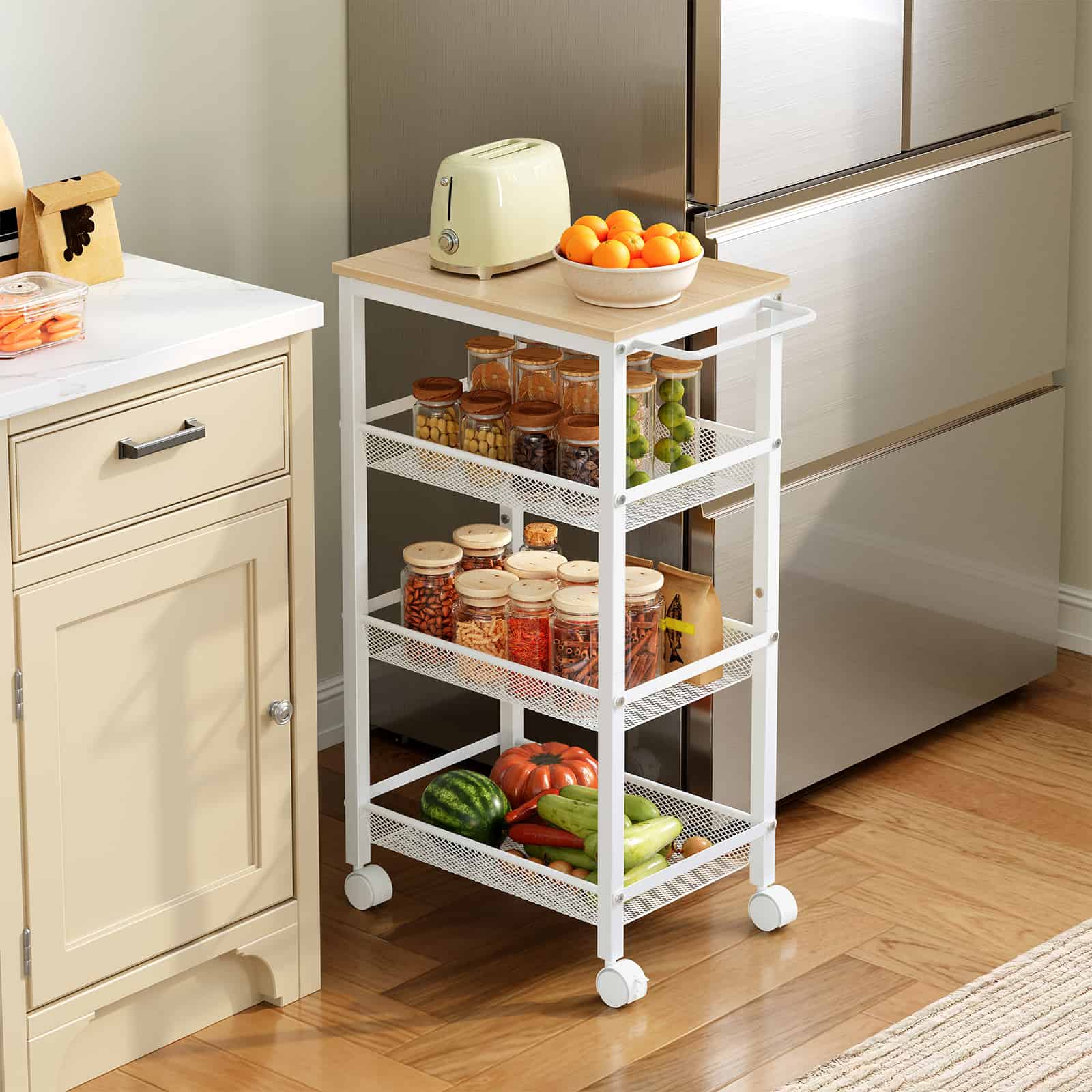 Slim white kitchen rolling cart with a wooden top holding a toaster and orange bowl, placed in the gap between a cabinet and refrigerator.