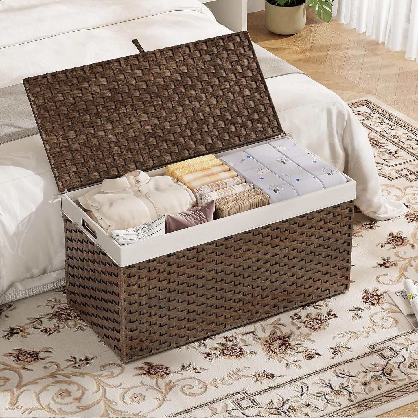 Woven storage basket with clothes on a bed in a bedroom