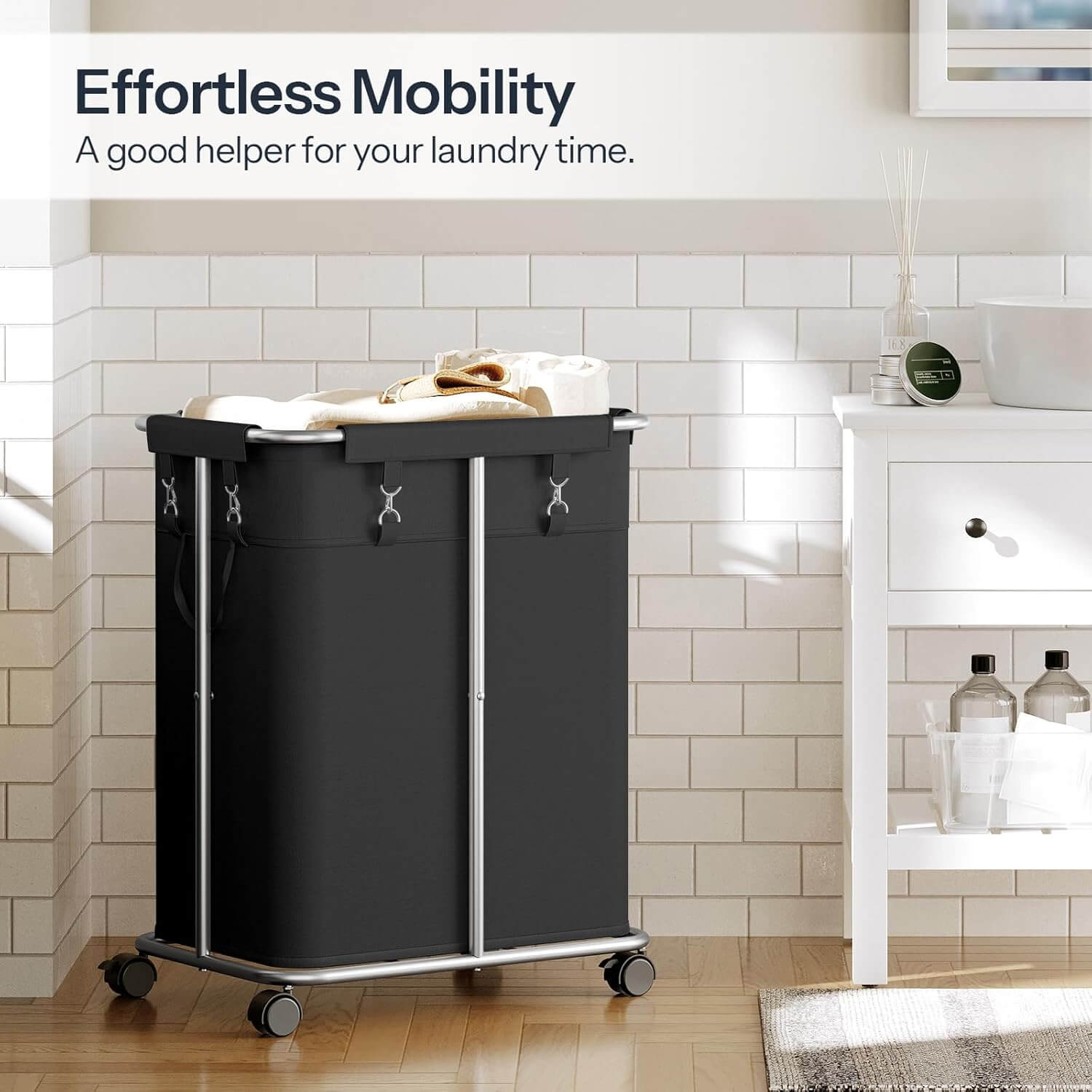 Black laundry cart with wheels in a bathroom setting, featuring text 'Effortless Mobility'.