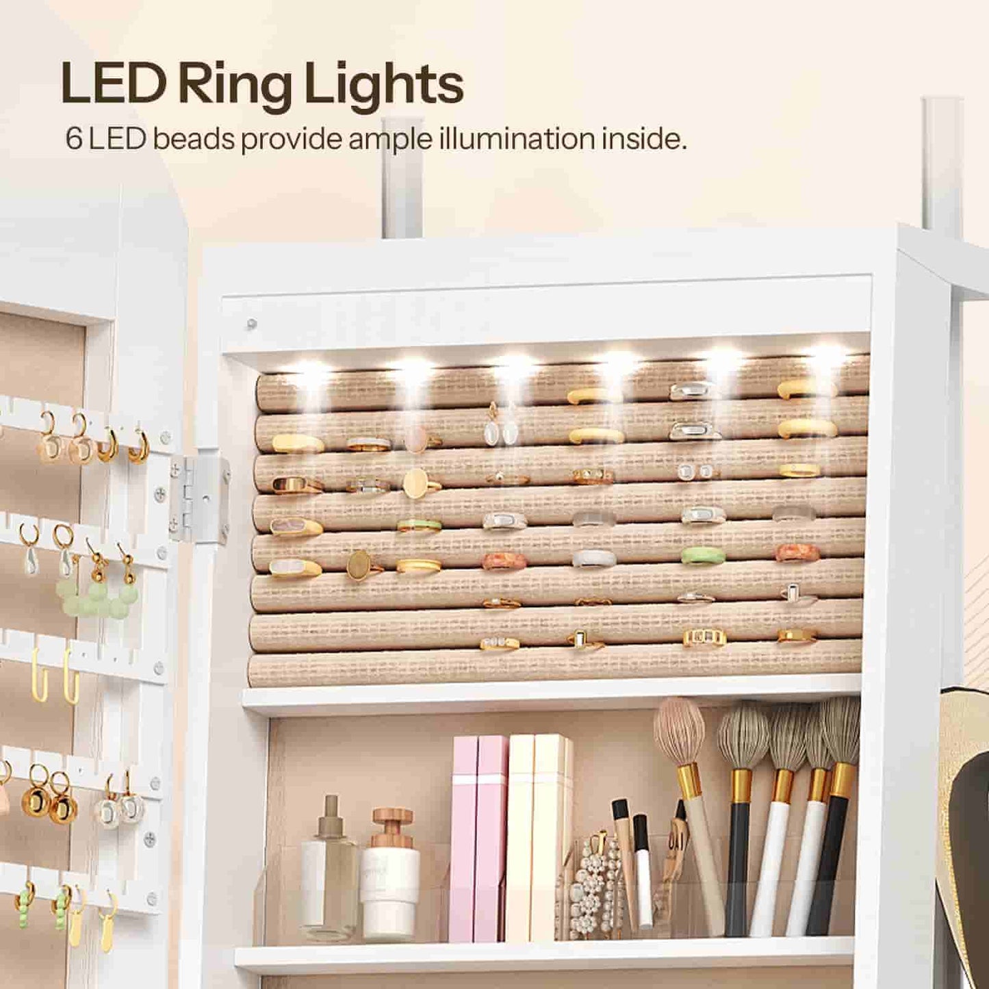 Close-up of the automatic interior LED strip lights illuminating the earrings and cosmetics inside the cabinet.