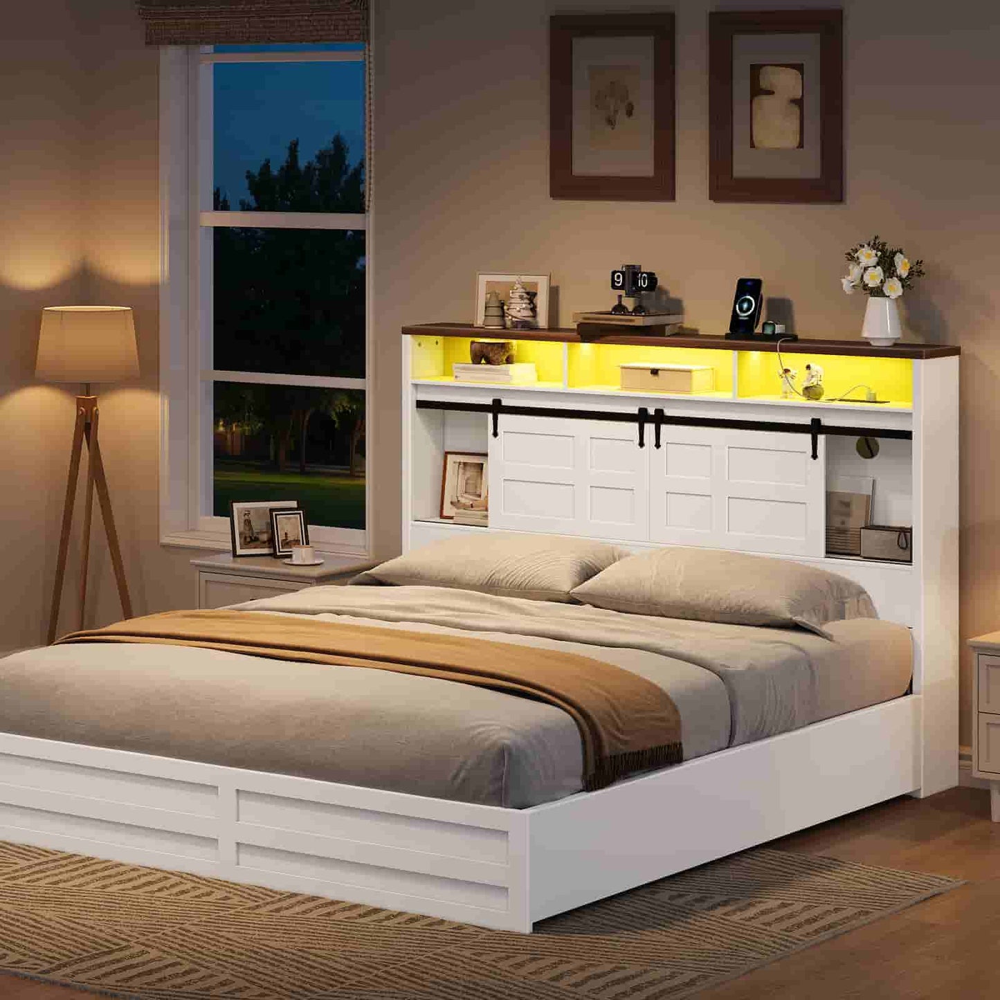  Freestanding farmhouse headboard with glowing ambient yellow lights and closed sliding barn doors next to a bed.