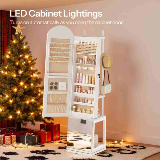 White 360-degree rotating jewelry cabinet with LED lights open next to a glowing Christmas tree.