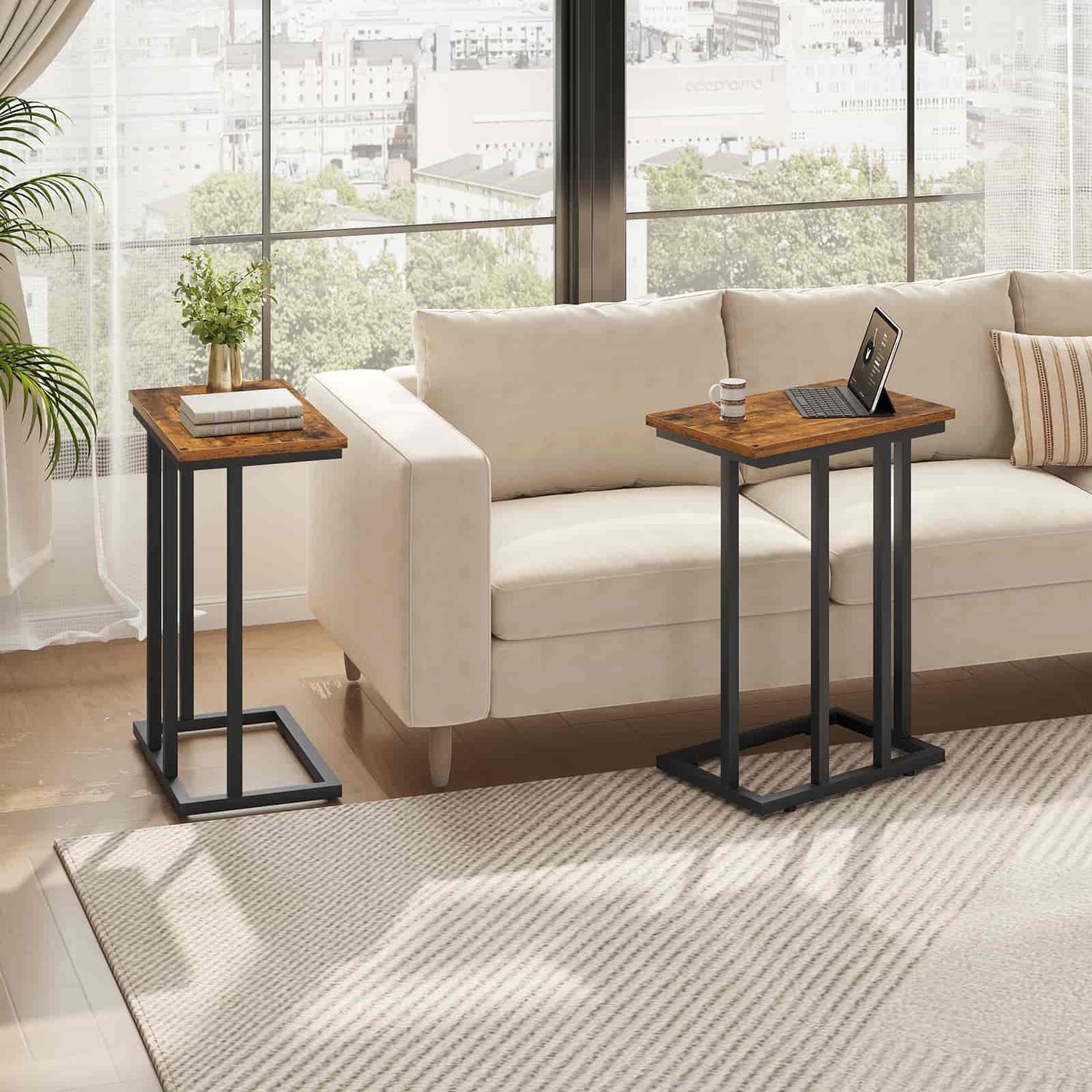 Two wooden side tables with black metal legs in a living room setting.