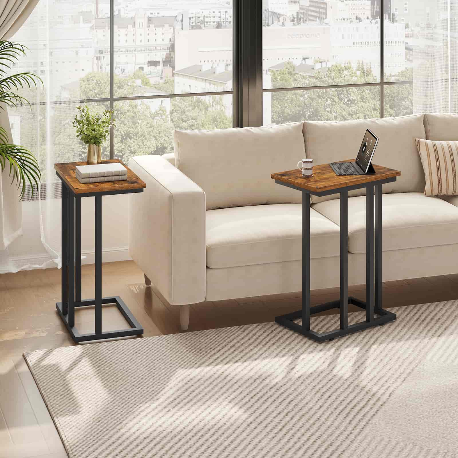 Two wooden side tables with black metal legs in a living room setting.