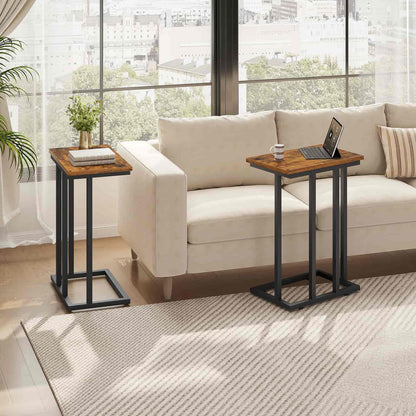 Two wooden side tables with black metal legs in a living room setting.