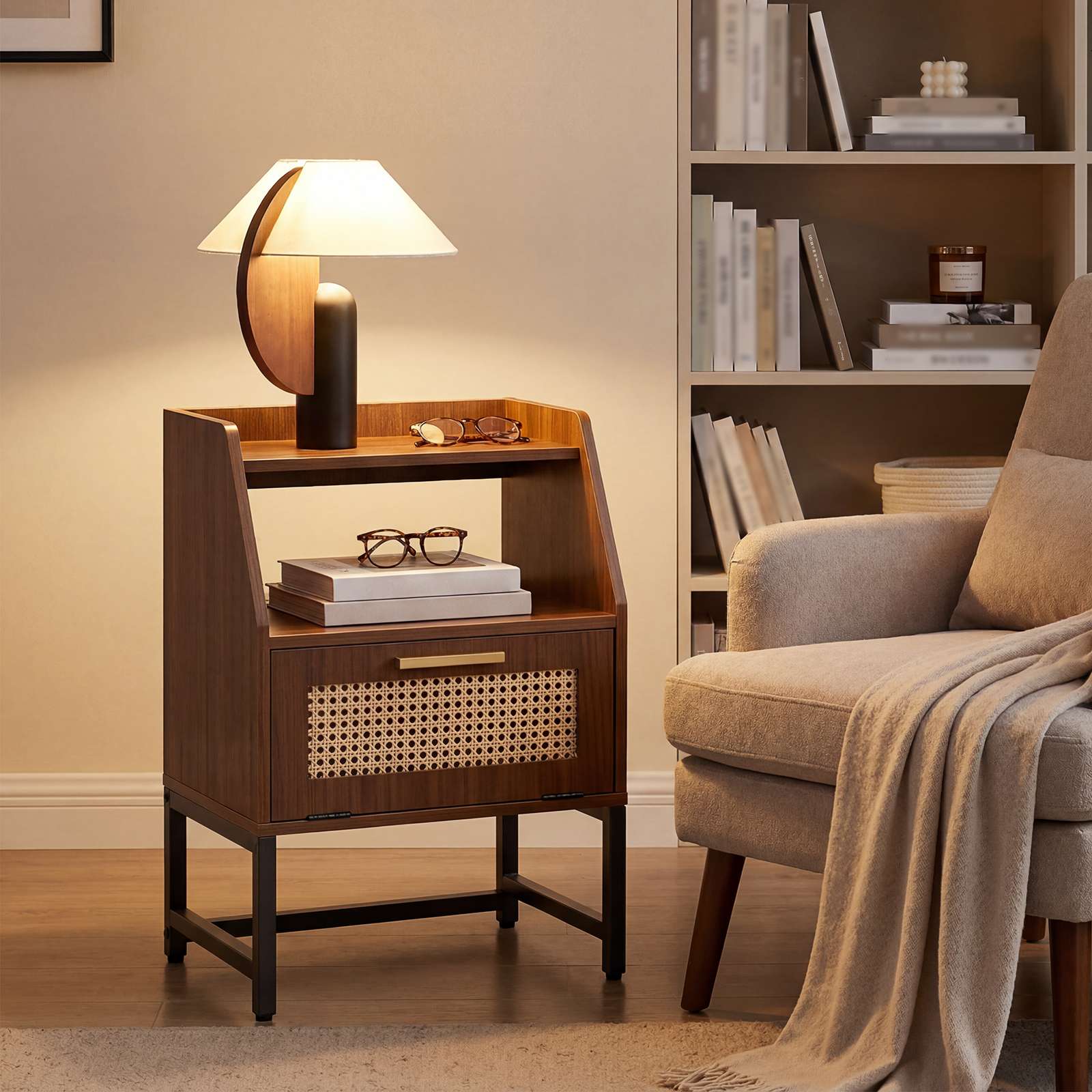 Mid-century accent table styled with a modern lamp in a cozy reading corner next to an armchair.