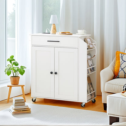 White kitchen cart with storage compartments in a bright room with a chair and plant.