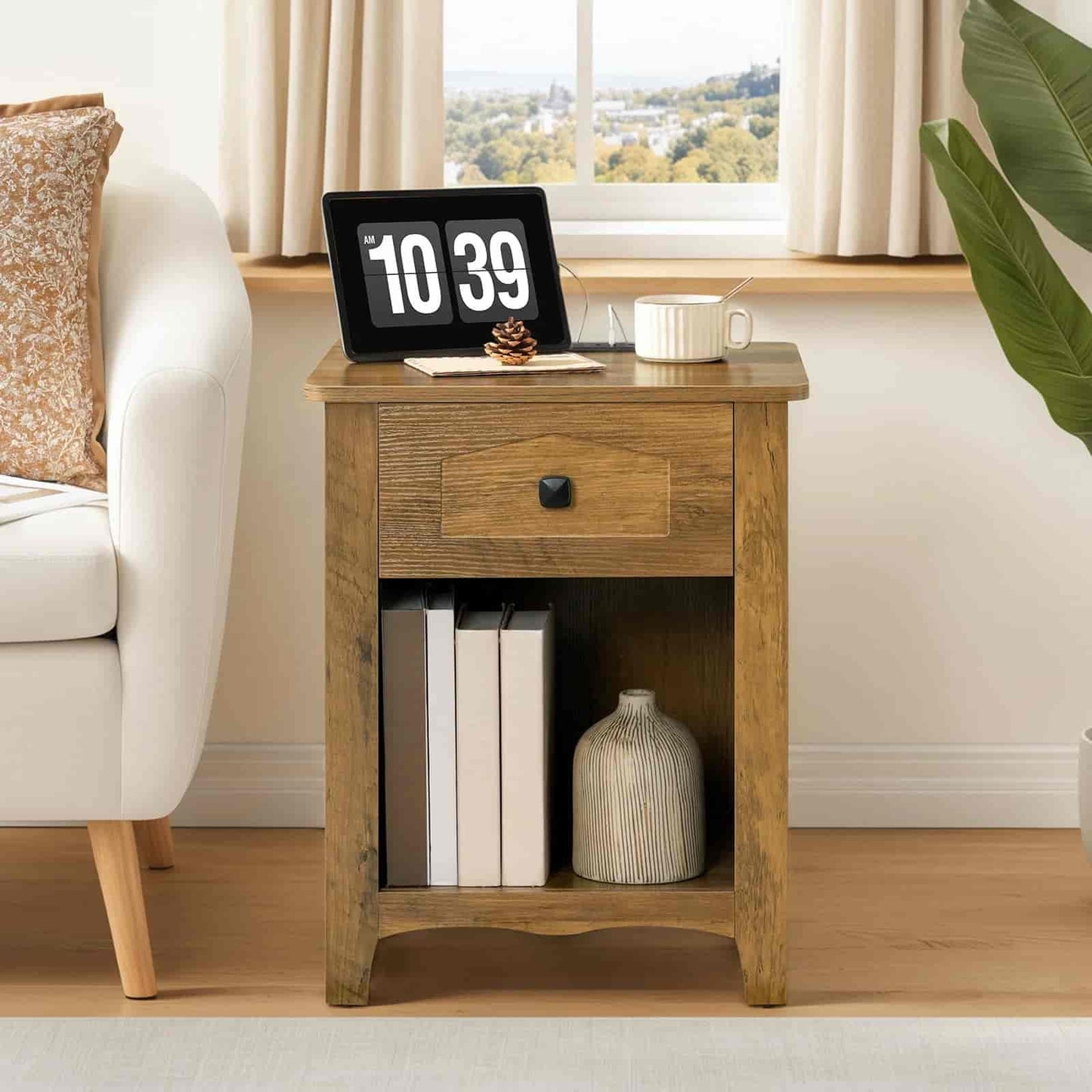 Wooden side table with digital clock, books, and vase in a living room setting.