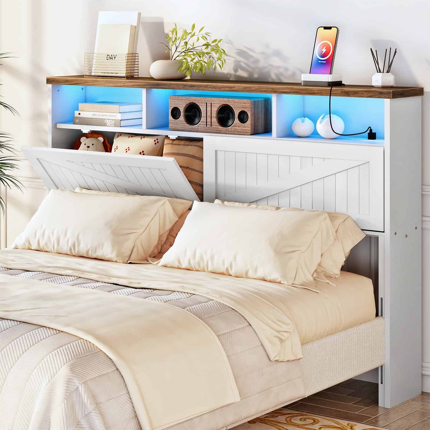 White farmhouse storage headboard with an open drop-down hidden compartment and vibrant blue LED lighting in a cozy bedroom.