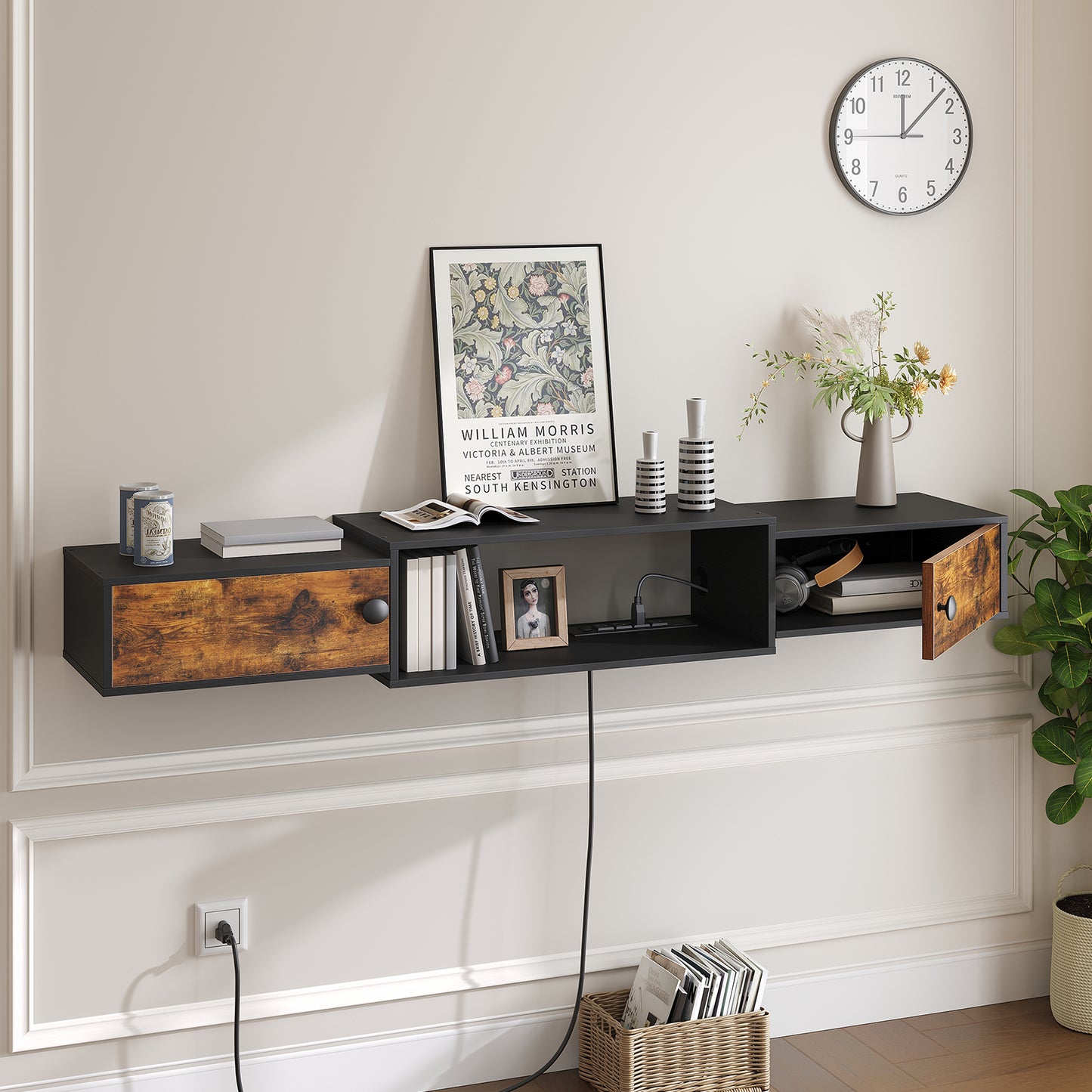 Wall-mounted black shelf with wooden drawers, decorative items, and a clock on a white wall.