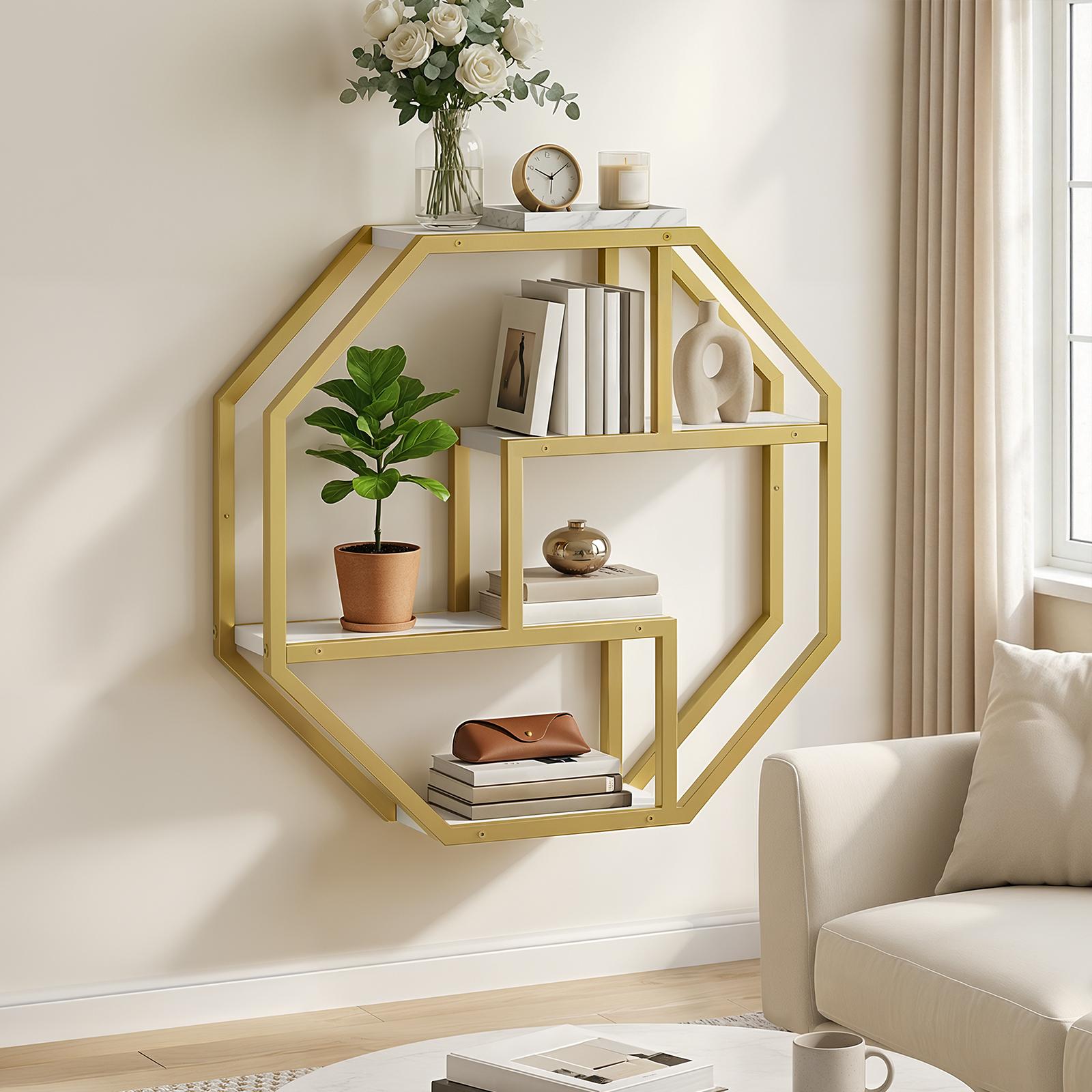Luxury gold geometric wall shelf installed in a modern living room displaying potted plants and books.