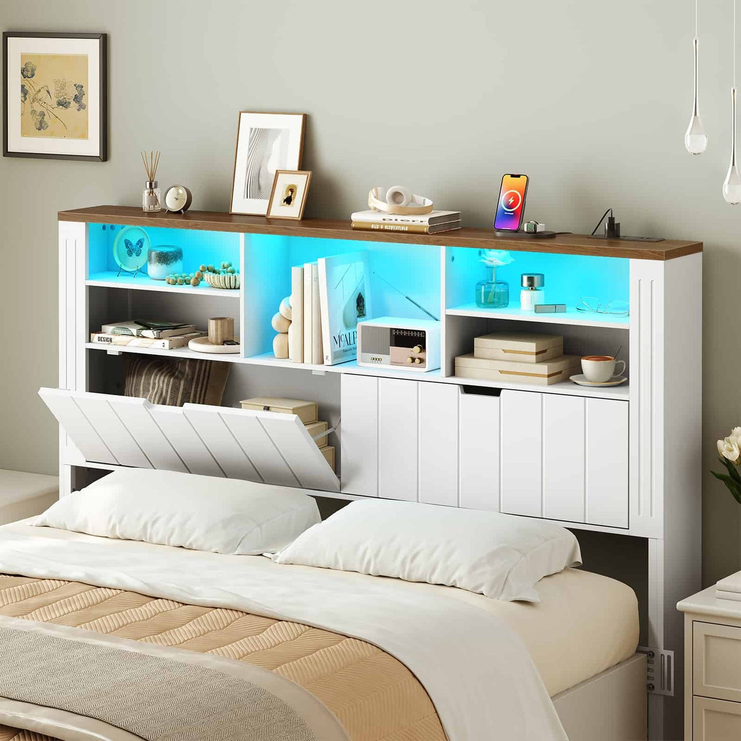 Modern bedroom setup showcasing the storage headboard illuminated with vibrant cyan blue LED ambient lighting.