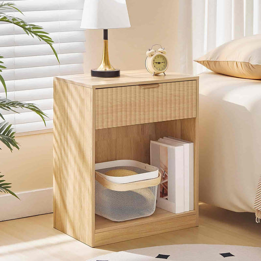 Wooden nightstand with a lamp, clock, and books in a bedroom setting.