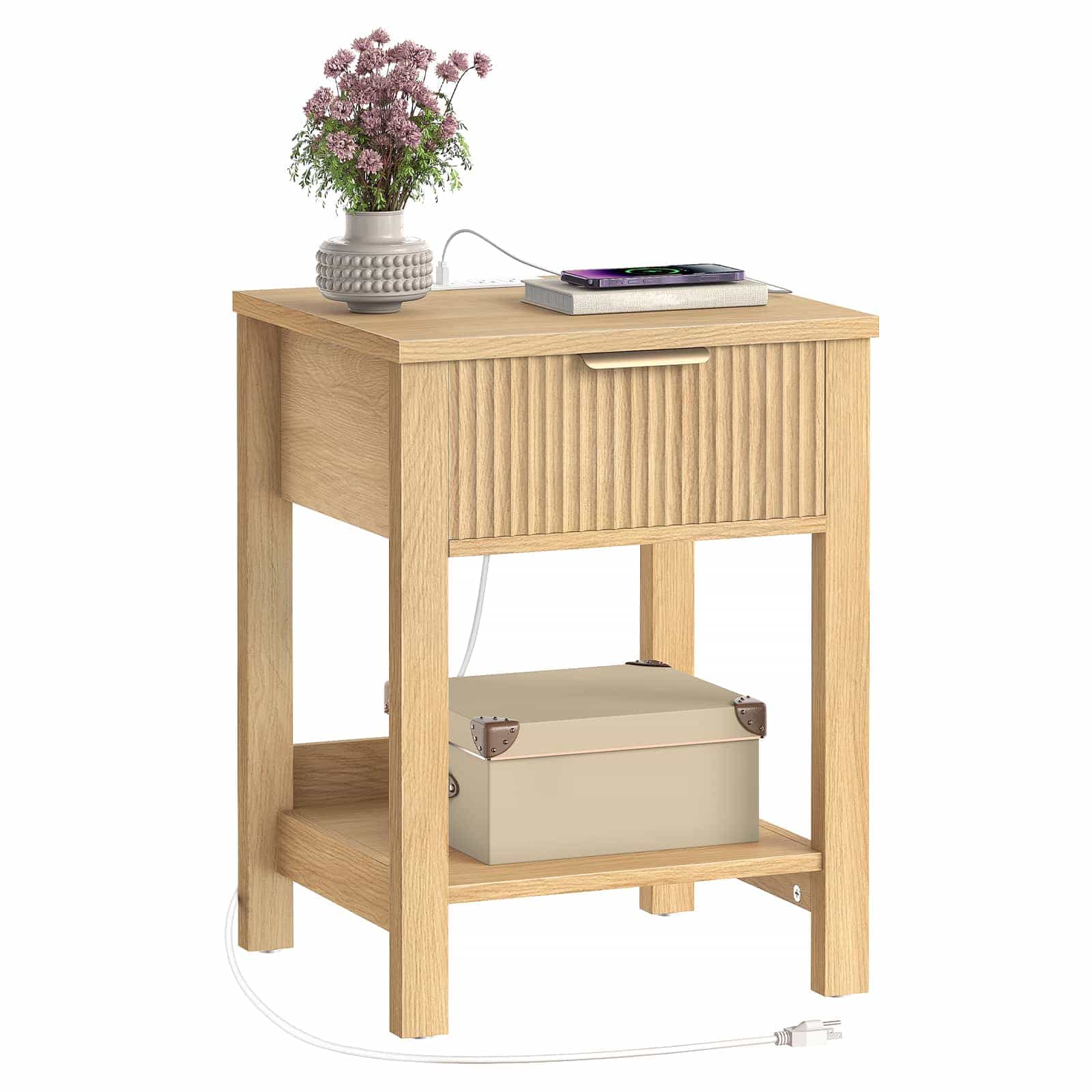 Wooden side table with a drawer and shelf, featuring a plant and electronic device on top.