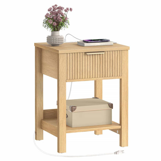 Wooden side table with a drawer and shelf, featuring a plant and electronic device on top.