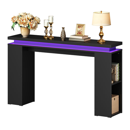 Narrow entryway table with open side storage shelves displaying decorative table lamps