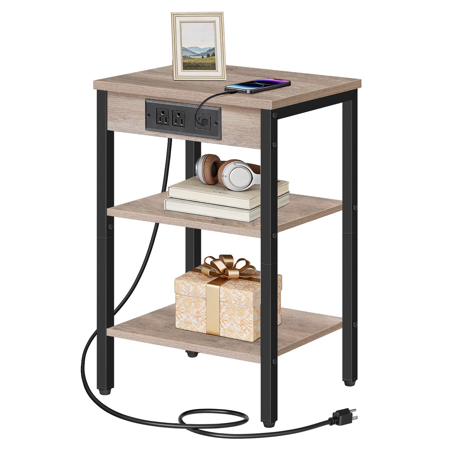 Narrow greige wood side table with a built-in black charging station holding a phone and books.