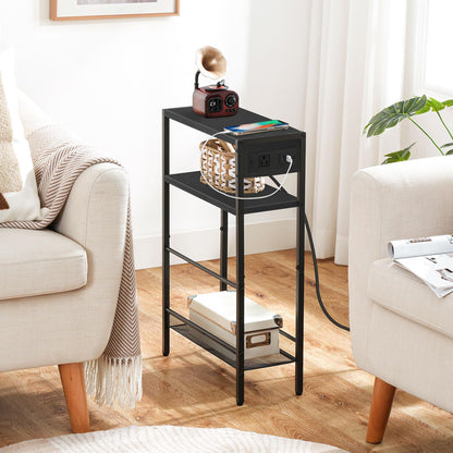 Narrow black sofa side table fitted perfectly inside a tight gap between two modern cream armchairs.