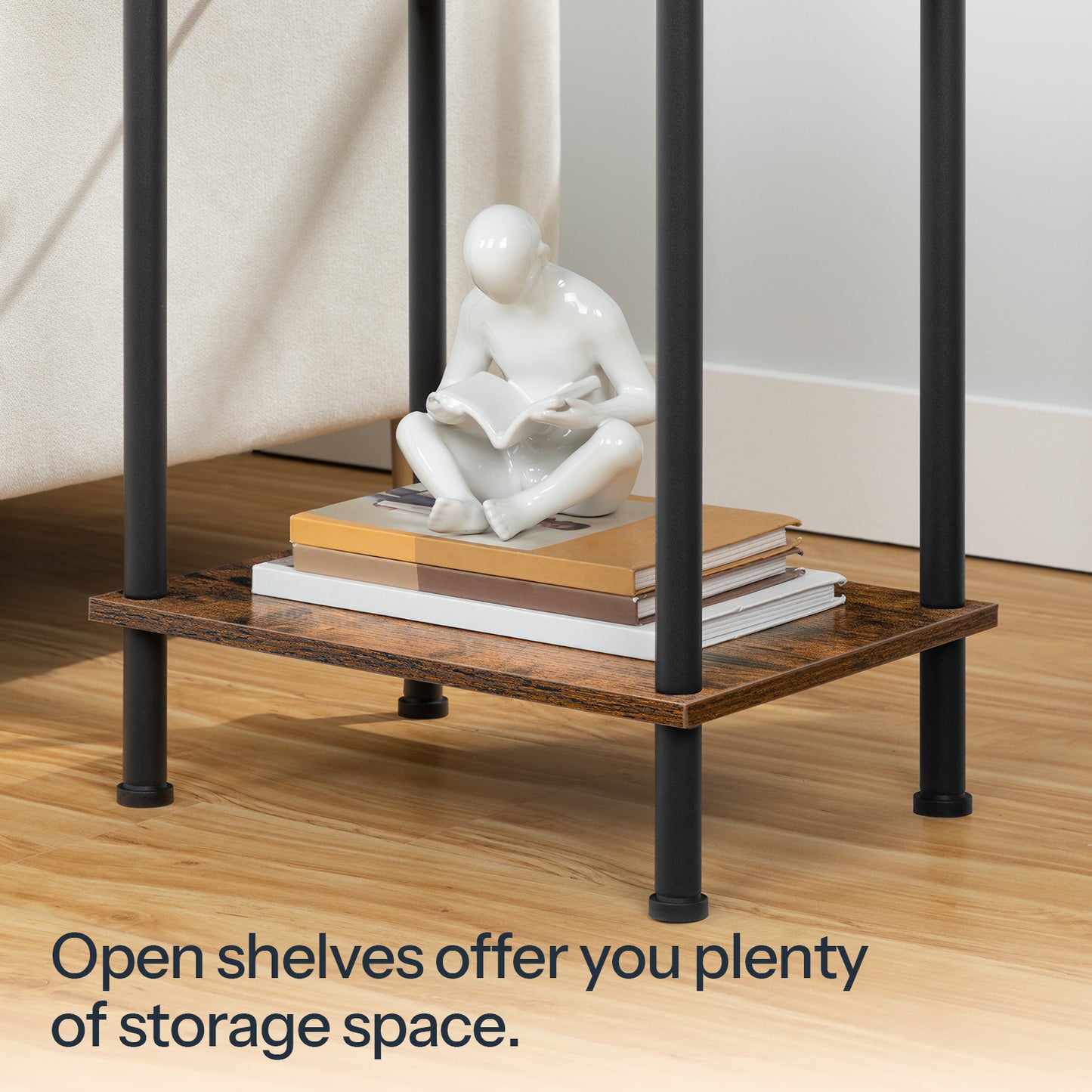 Close up of the open storage shelf layout holding books and a white human art sculpture under a black metal frame.
