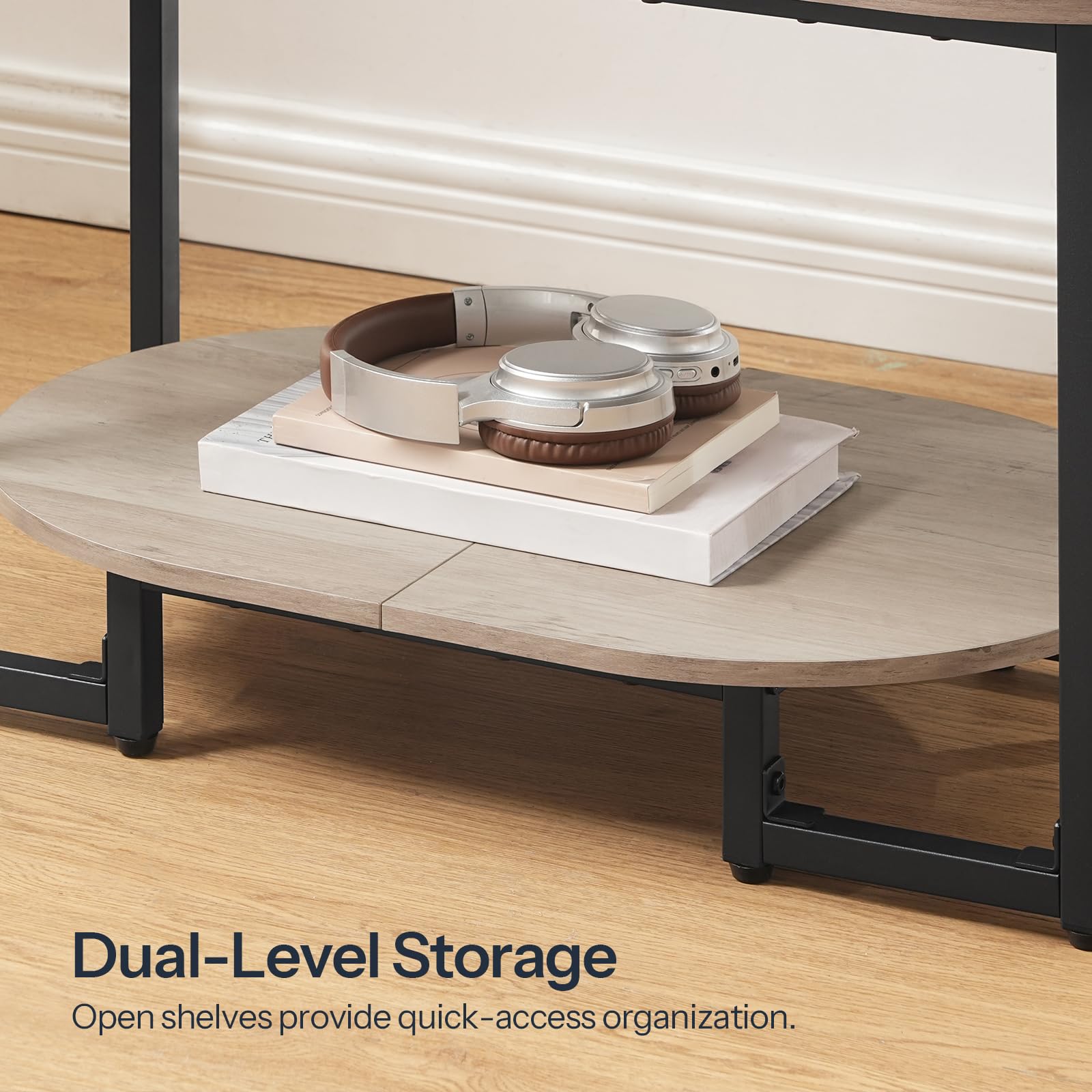 Close-up view of the lower shelf highlighting the dual-level open storage for books and decorative plates.
