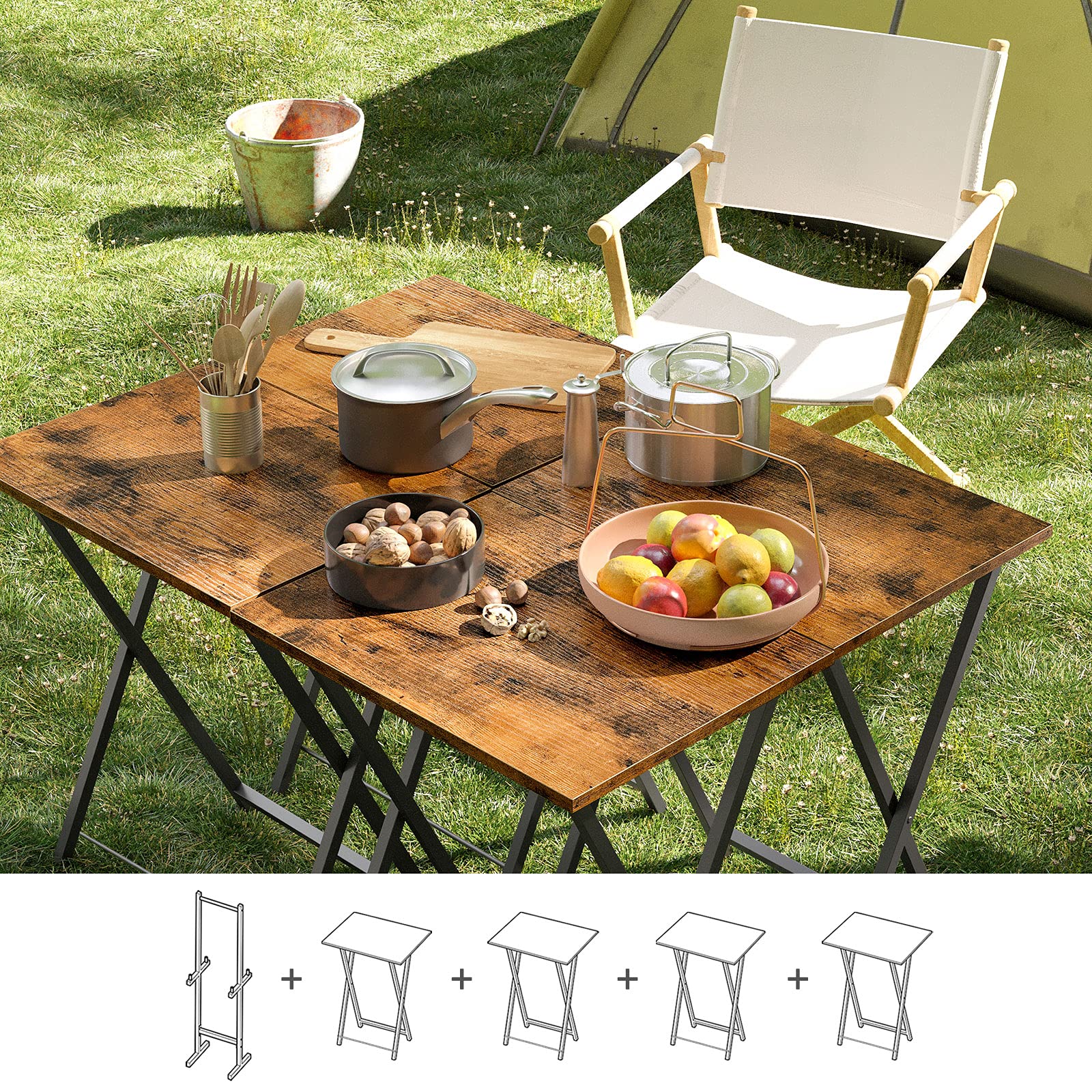 Portable camping tables placed together on grass for an outdoor backyard family picnic.