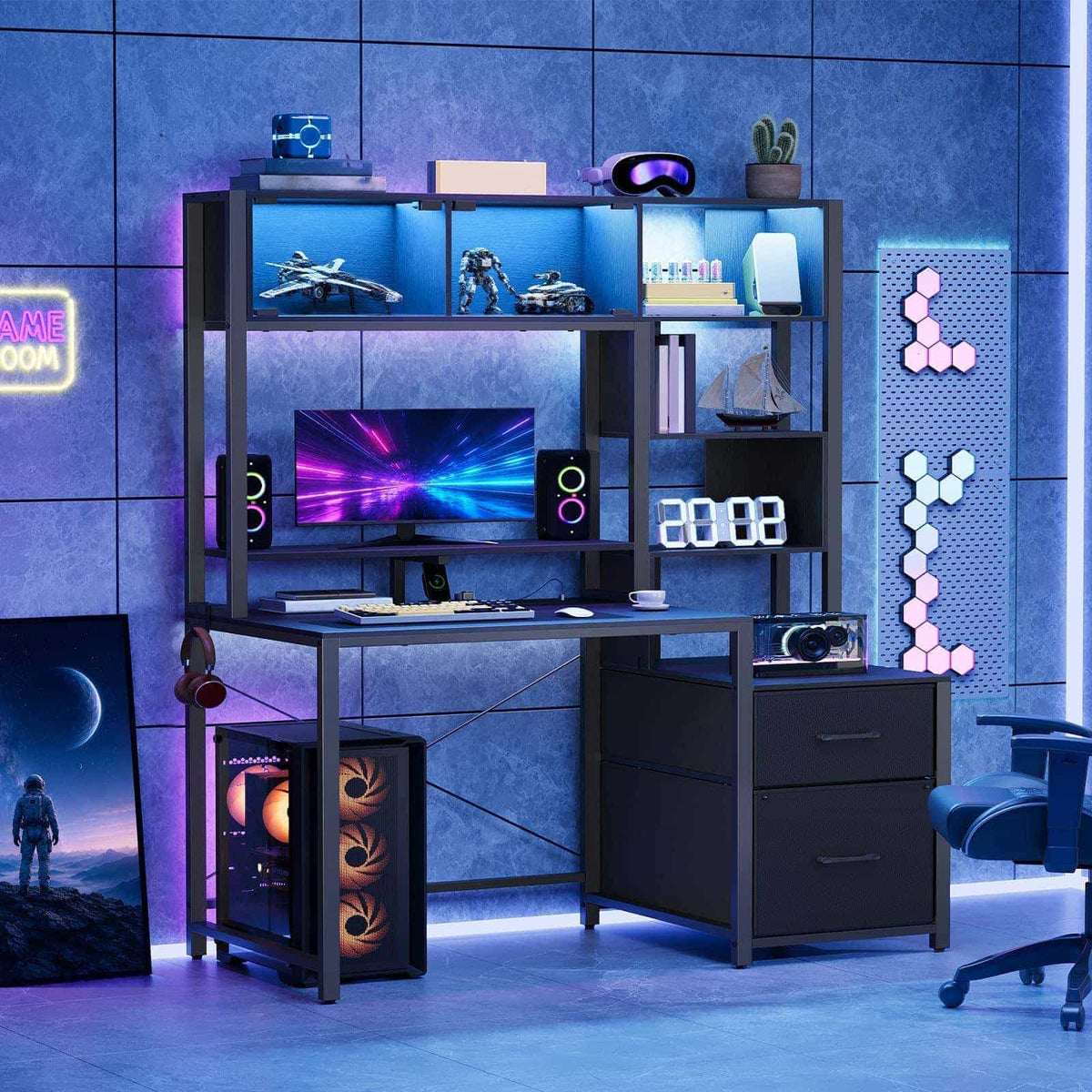 Immersive gaming room setup showcasing the black gaming desk glowing with colorful cool-toned neon LED lights at night.