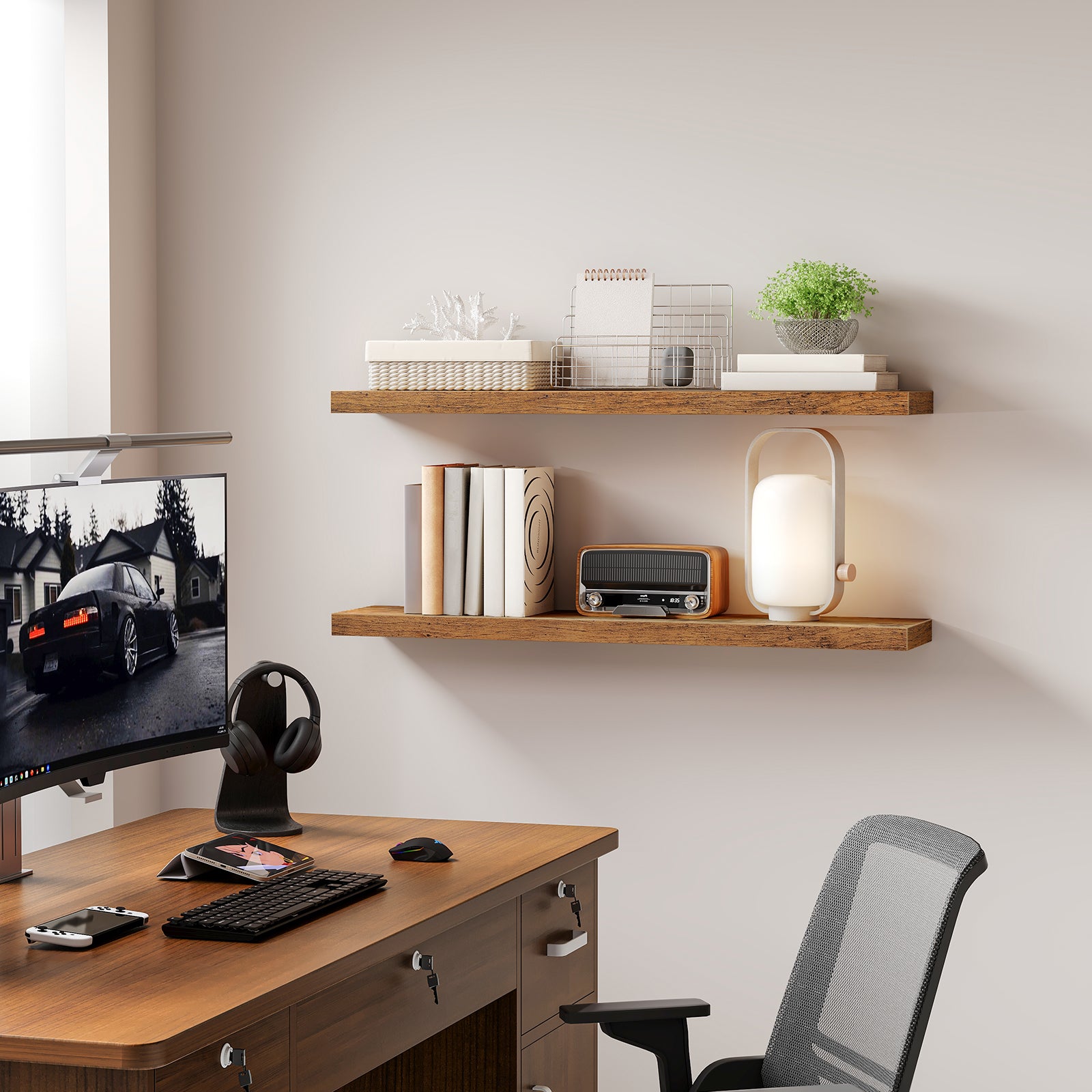 Two rustic brown floating shelves mounted on a wall above an office desk holding books and a lamp.