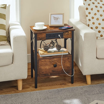 Rustic industrial end table placed in a gap between two living room sofas, holding coffee cups.