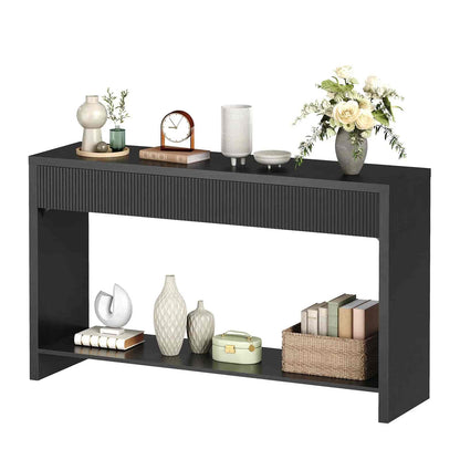 Black console table with decorative items on a white background