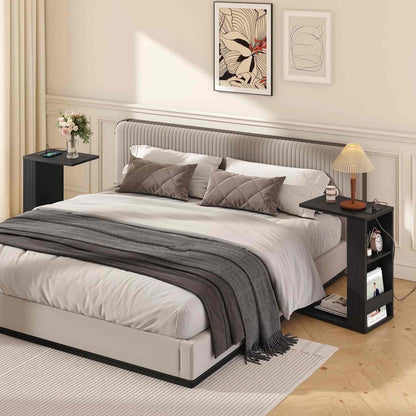 Neatly made bed with gray bedding in a bedroom setting.