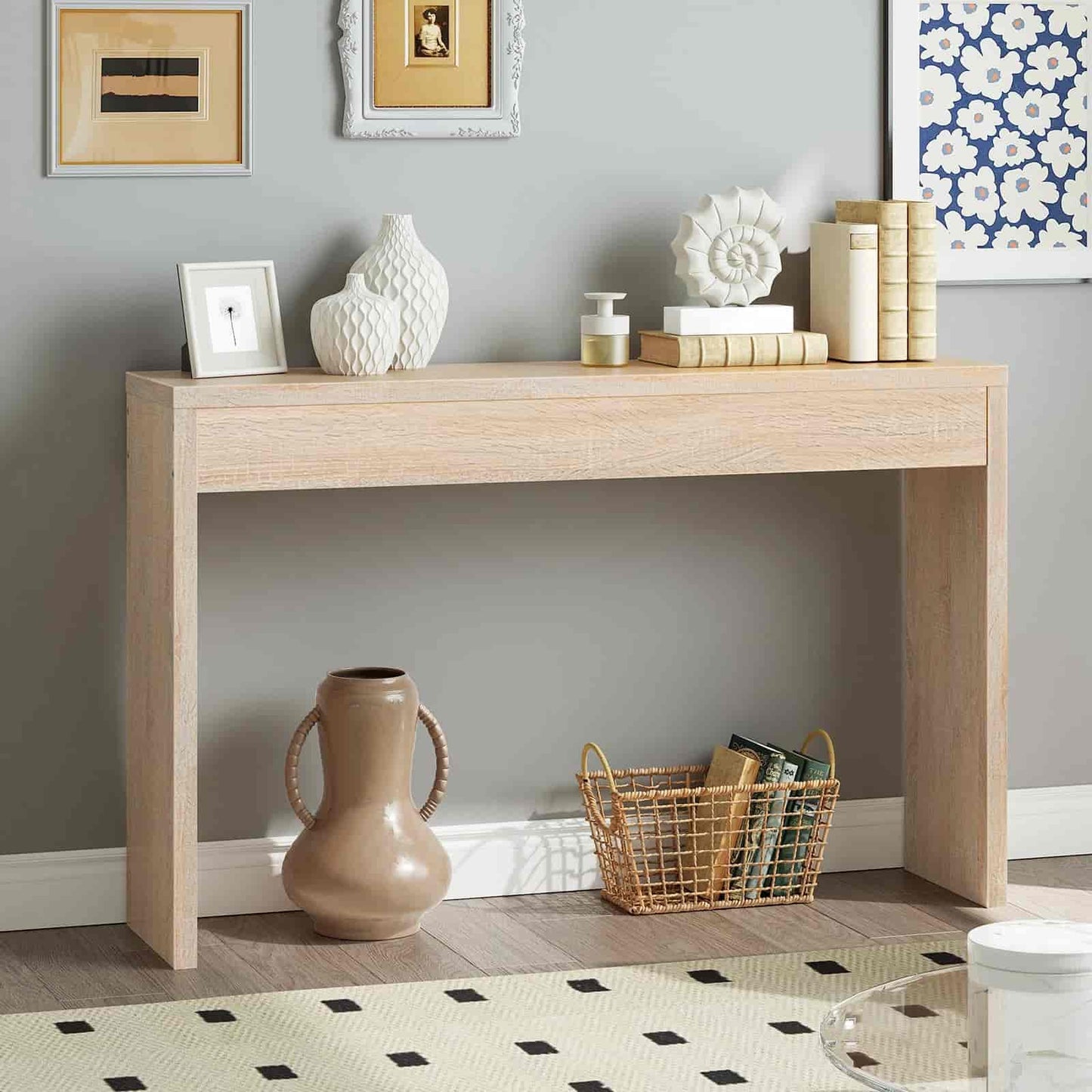 Wooden console table with decorative items against a gray wall