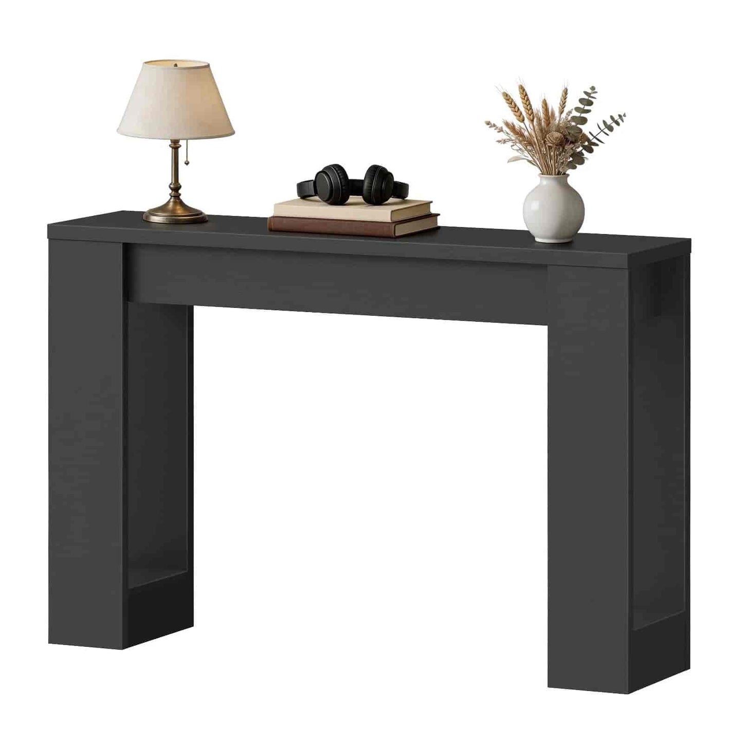 Black console table with decorative items on a white background