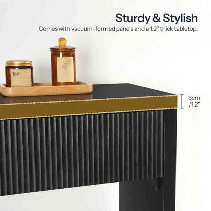 Black and gold table with decorative items on a white background