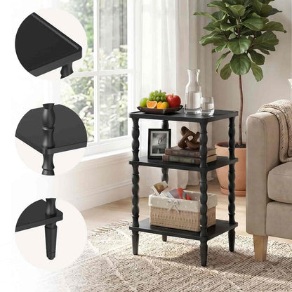 Black side table with decorative items in a living room setting