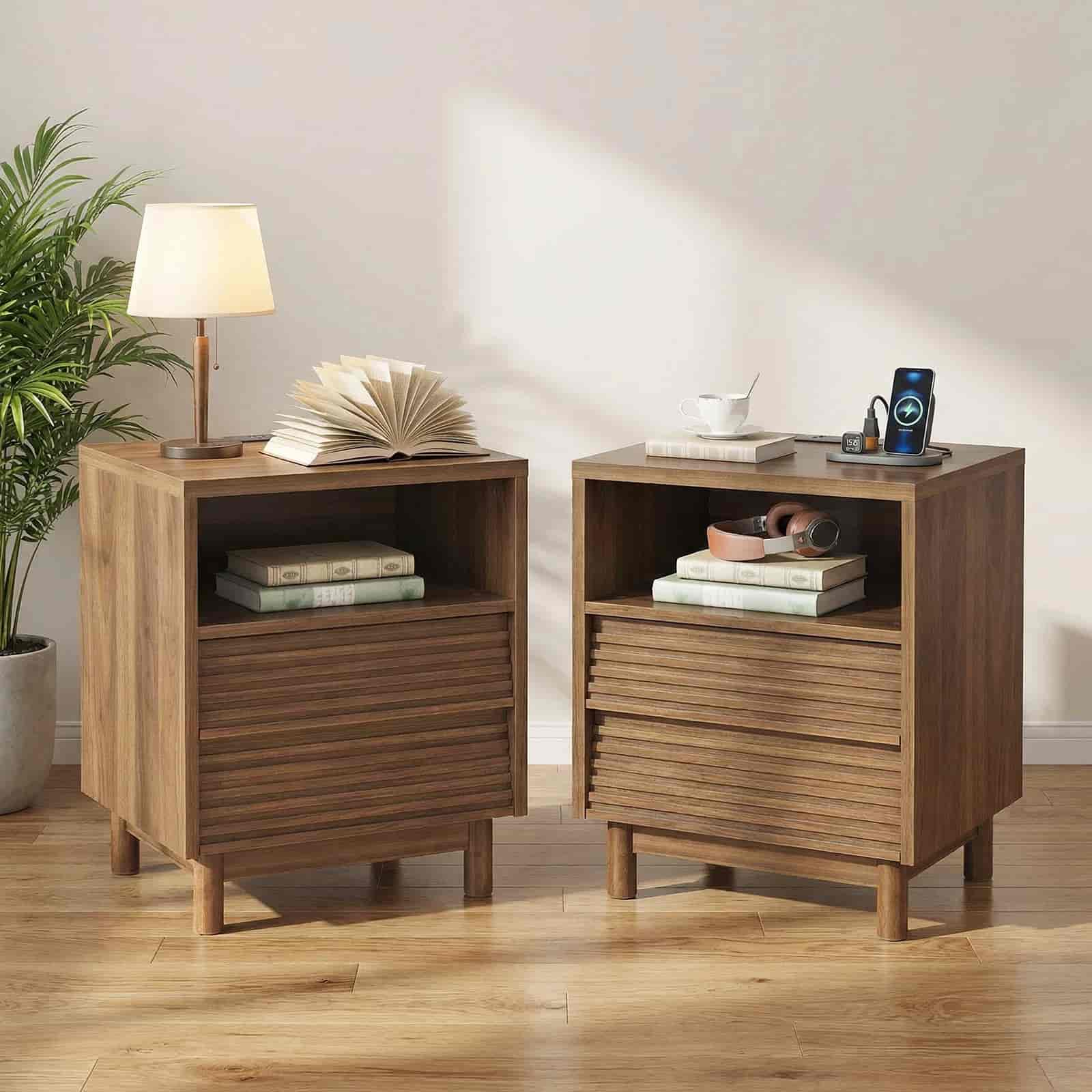 Two wooden nightstands with books and a lamp in a room setting.