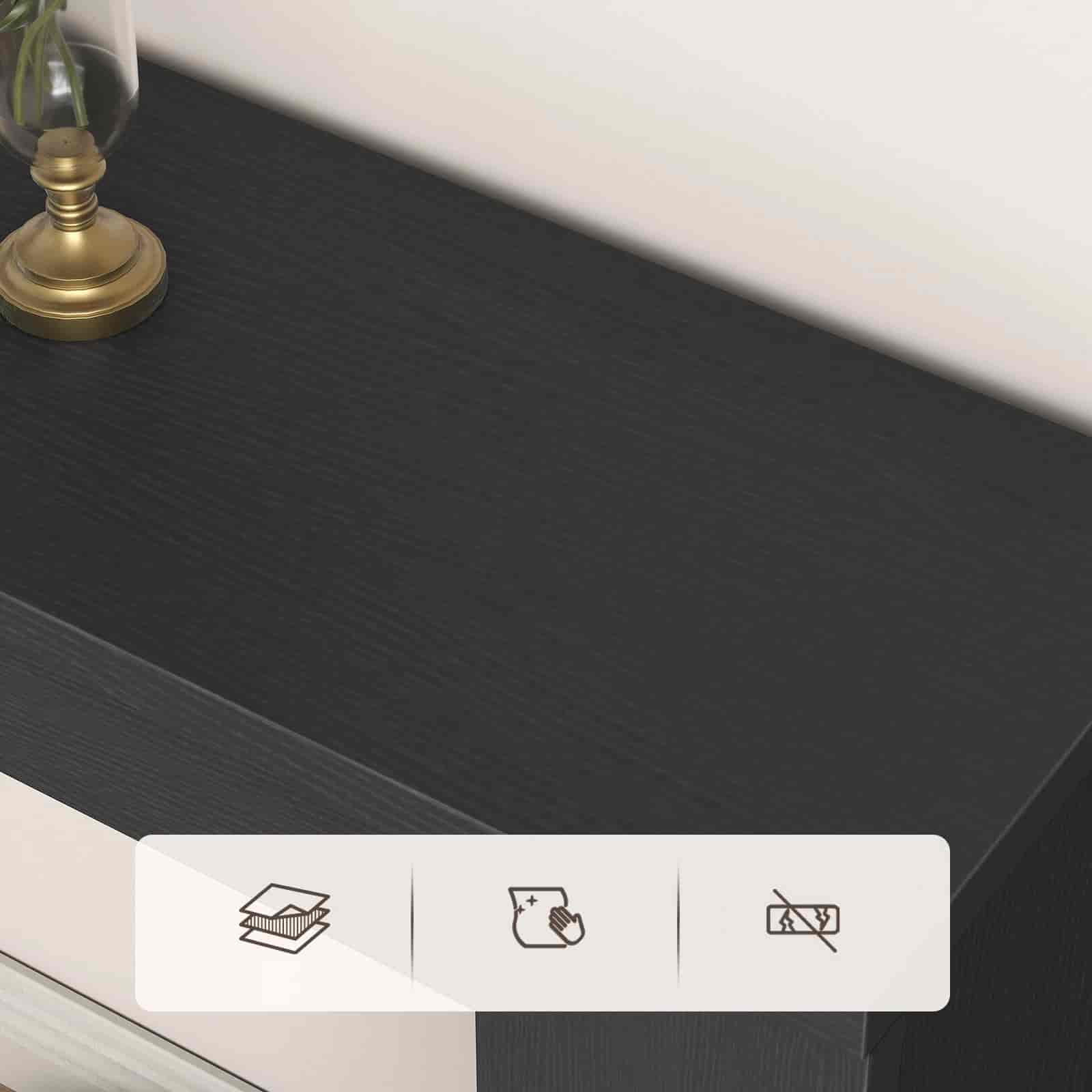 Dark wooden surface with a small plant and decorative item, featuring icons for book, paper, and scissors.