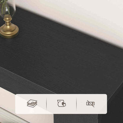 Dark wooden surface with a small plant and decorative item, featuring icons for book, paper, and scissors.