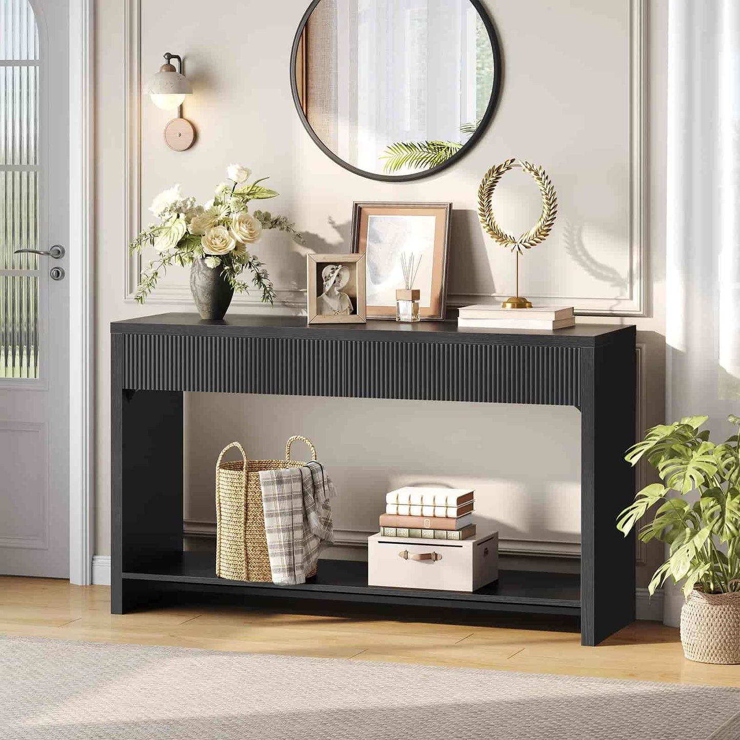 Black console table with decorative items in a room setting