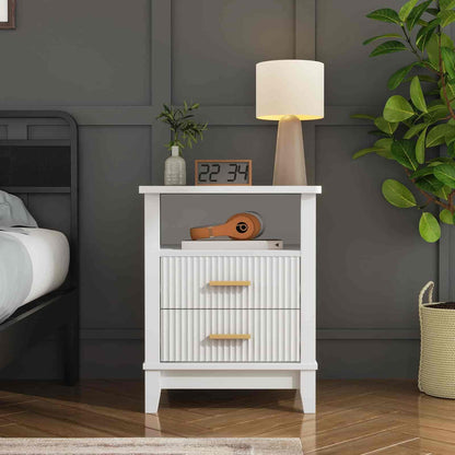 White nightstand with decorative items against a gray wall