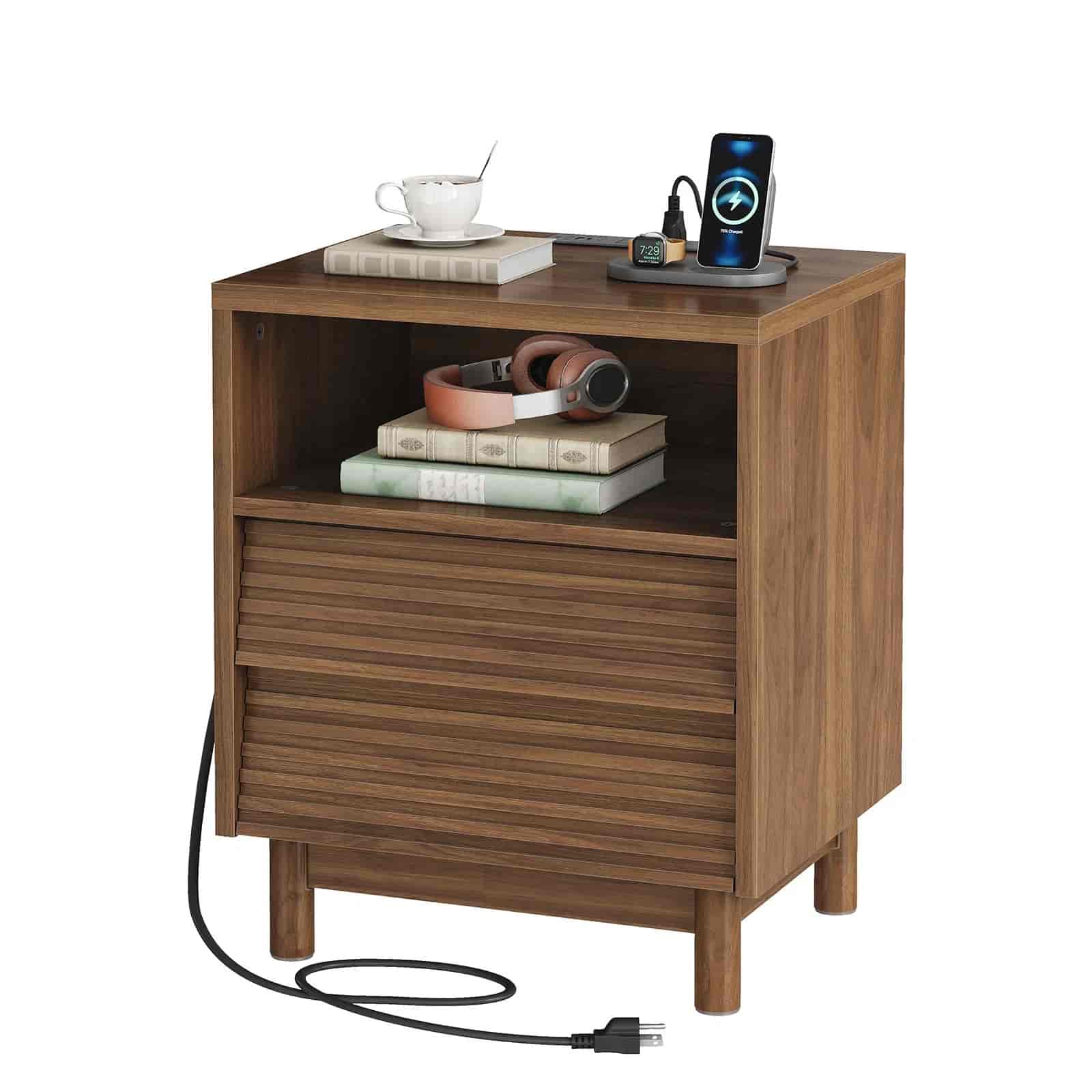 Wooden nightstand with electronic devices and books on a white background