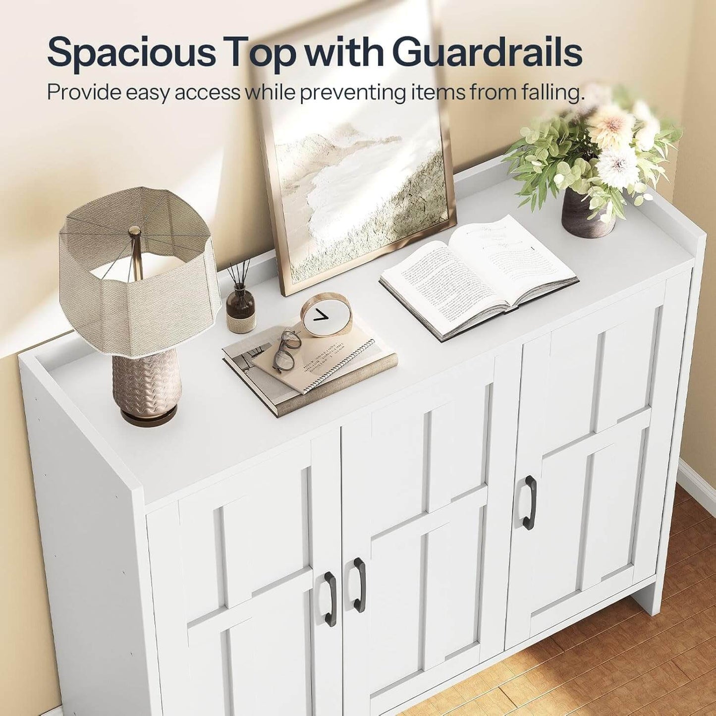 White cabinet with a spacious top and guardrails, featuring decor items.
