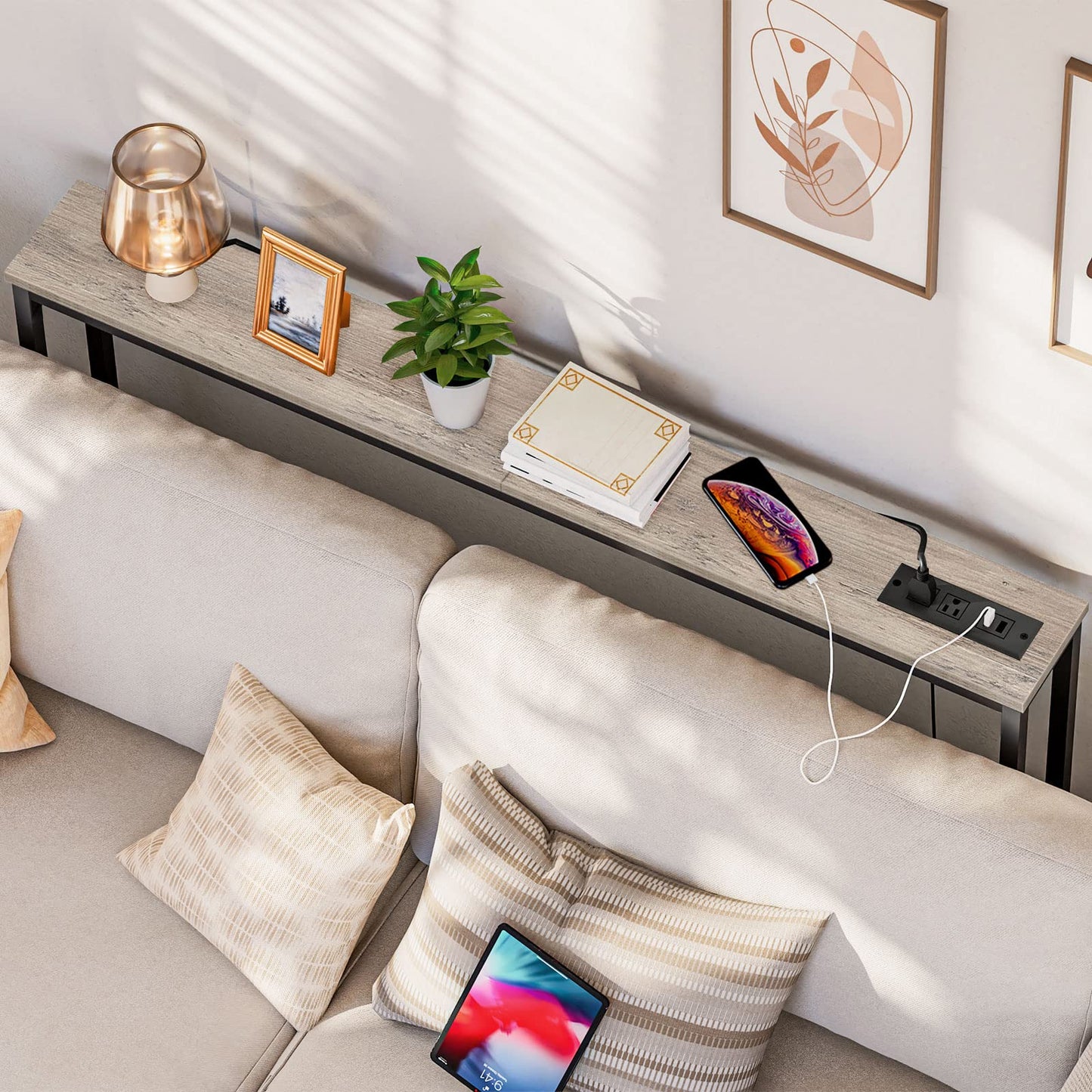 Modern living room with a sofa, coffee table, and decorative items.