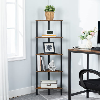 Skinny corner bookcase standing neatly next to a computer desk in a home office.