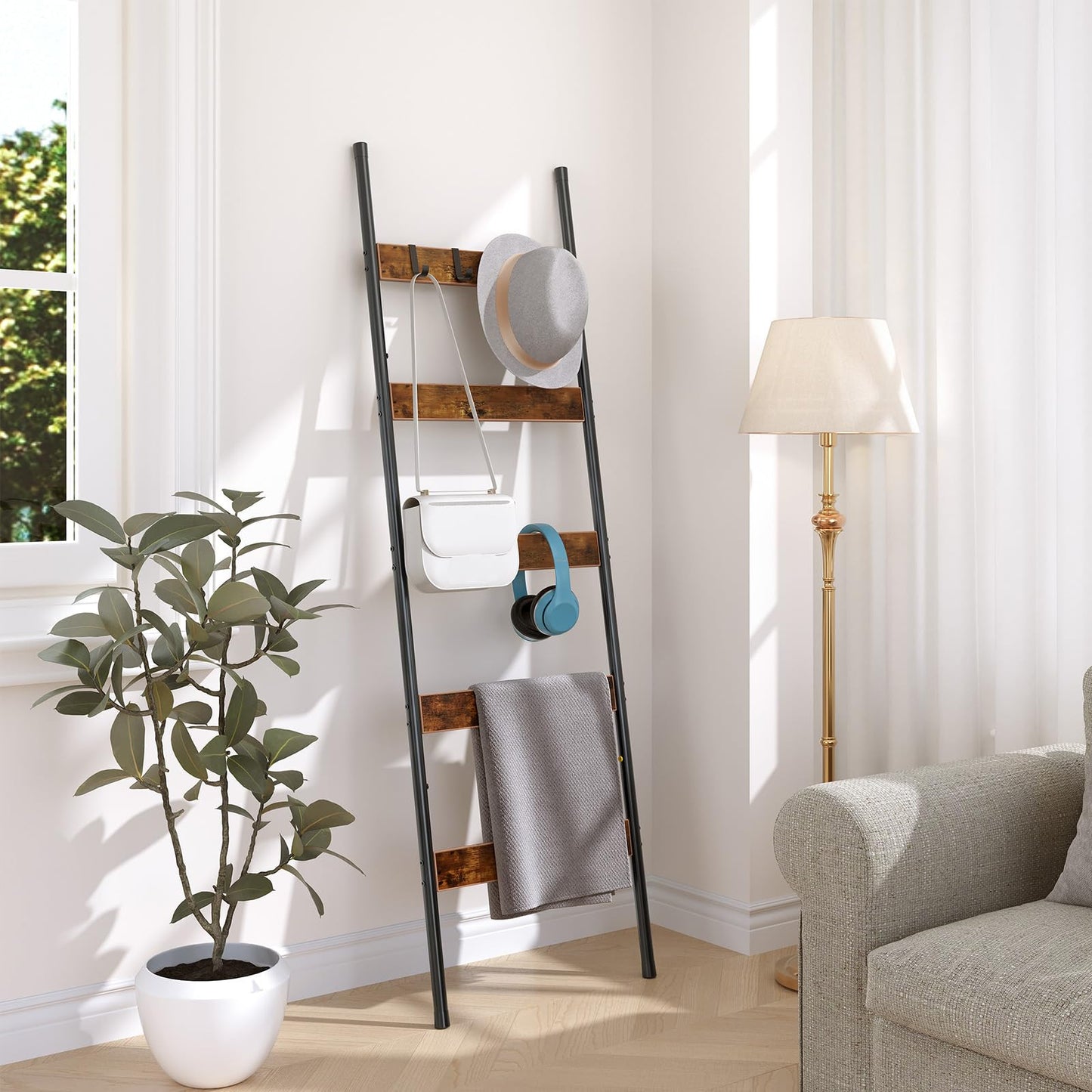 Skinny quilt holder rack tucked neatly into a small living room corner next to a floor lamp.