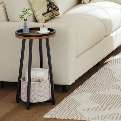 Skinny round sofa side table holding a ceramic tea mug placed next to a modern cream white fabric couch.